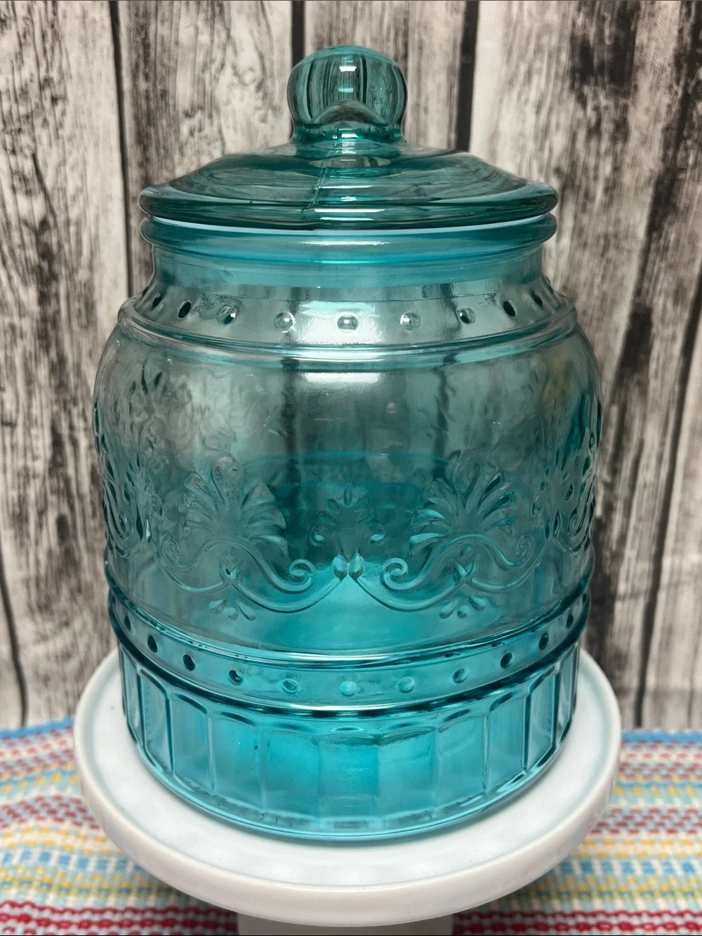 The Pioneer Woman “Cassie” Teal Embossed glass canister-Medium- 53.5 oz- 5.5”X7”